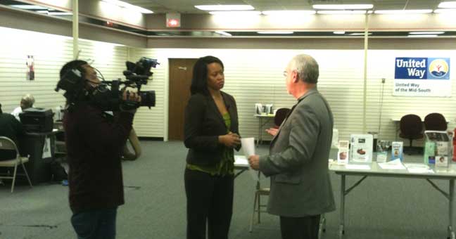 Dan Boone, IRS media specialist, is interviewed at the United Way supported EITCA / VITA free tax preparation site at Hickory Ridge Mall yesterday.