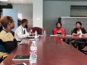 From left, Nidia Logan, Courtney Robertson, Karlisa Kuykindall and Tehrian Martin discuss plans for future Emerging Leaders projects.