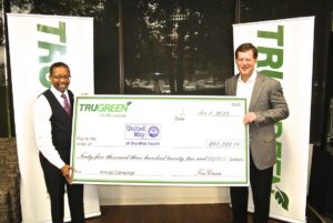 Alexander and Robinson with check for United Way
